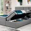 Storage compartments of the Emilia bed. Light grey fabric